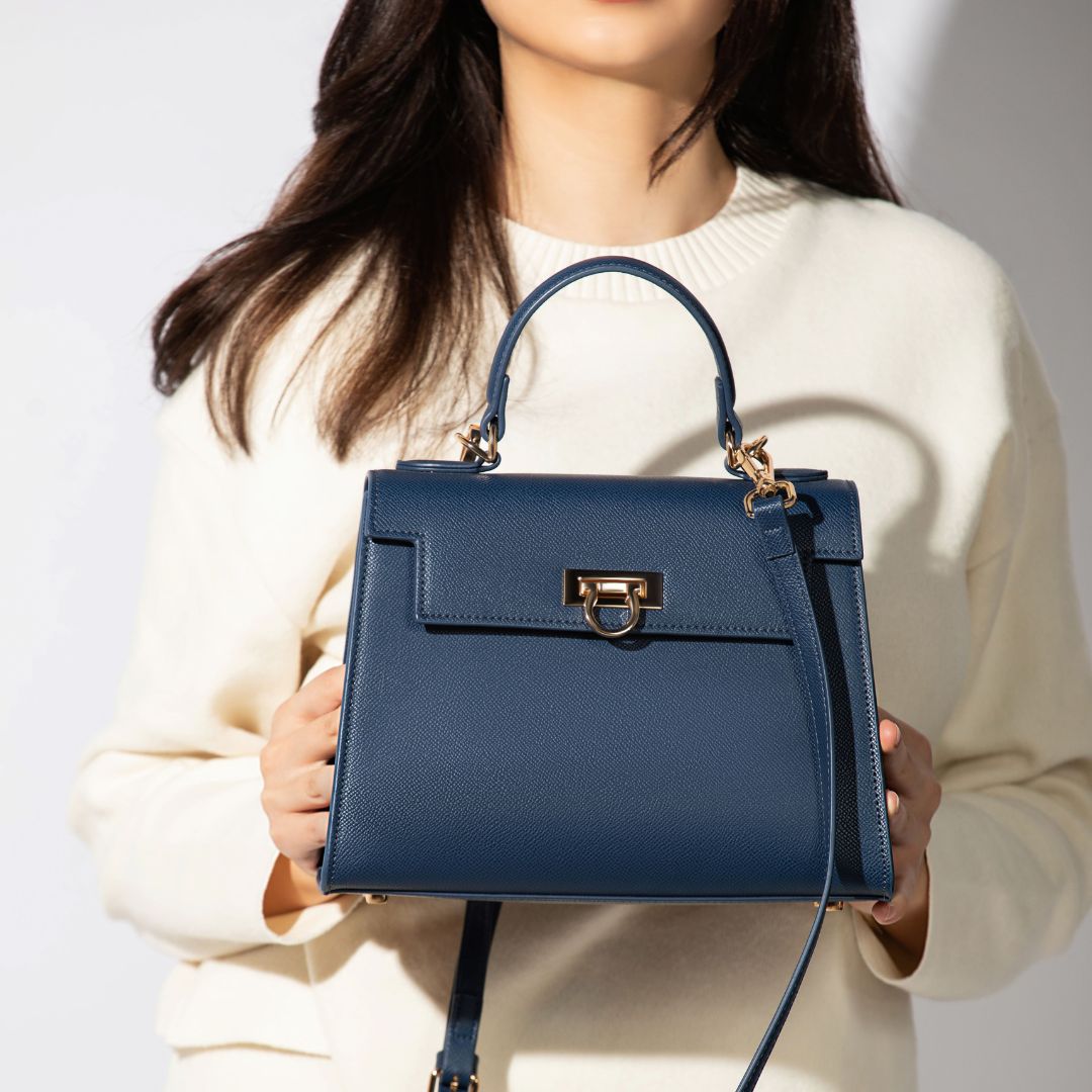 model with elegant navy blue bag