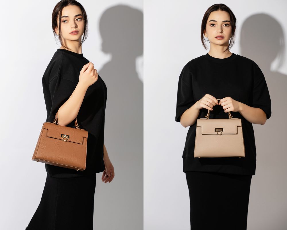 Fashionable women in monochrome outfits, clutching designer handbags by levantine